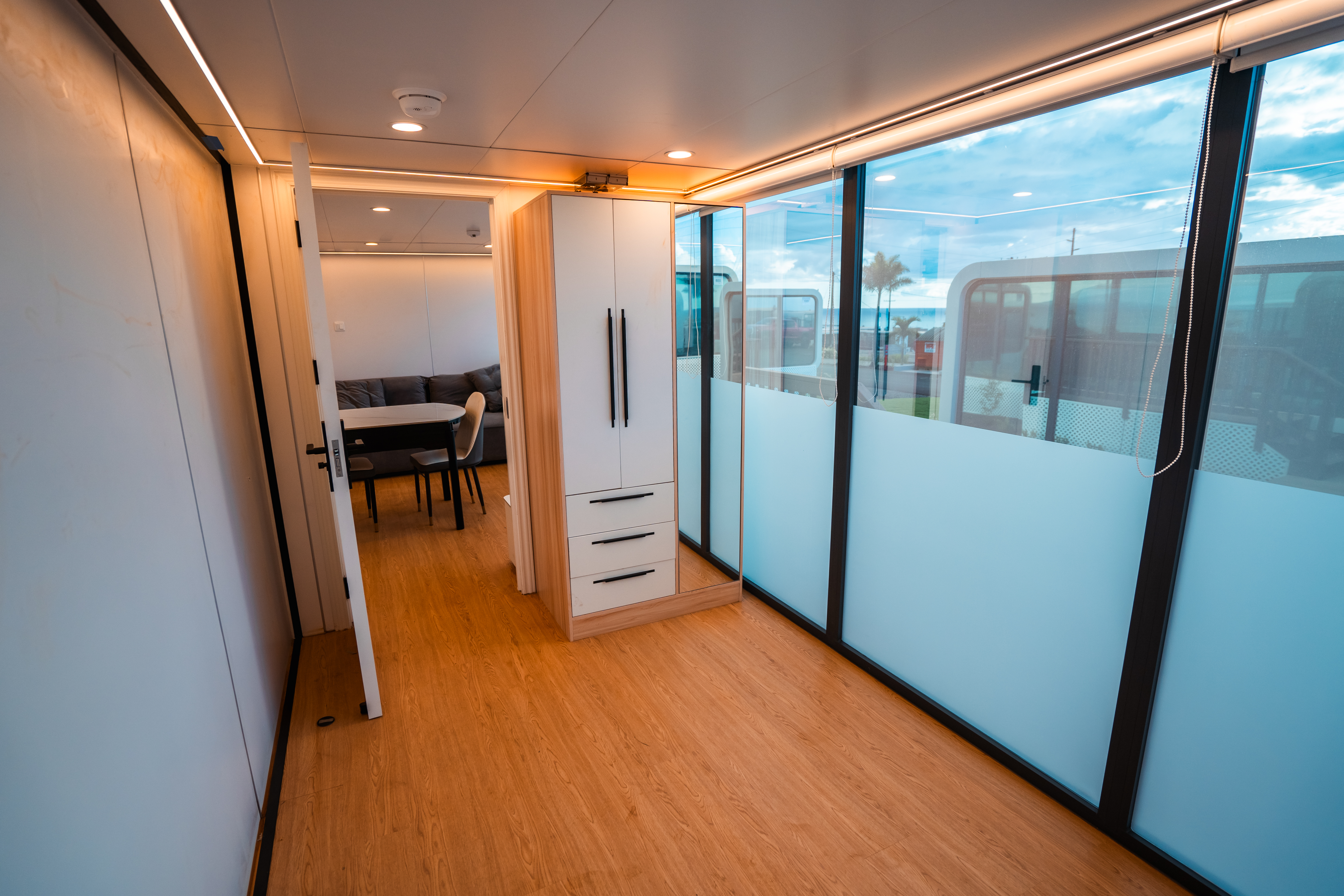 Double Unit bedroom — wardrobe, glass partition, floor-to-ceiling windows