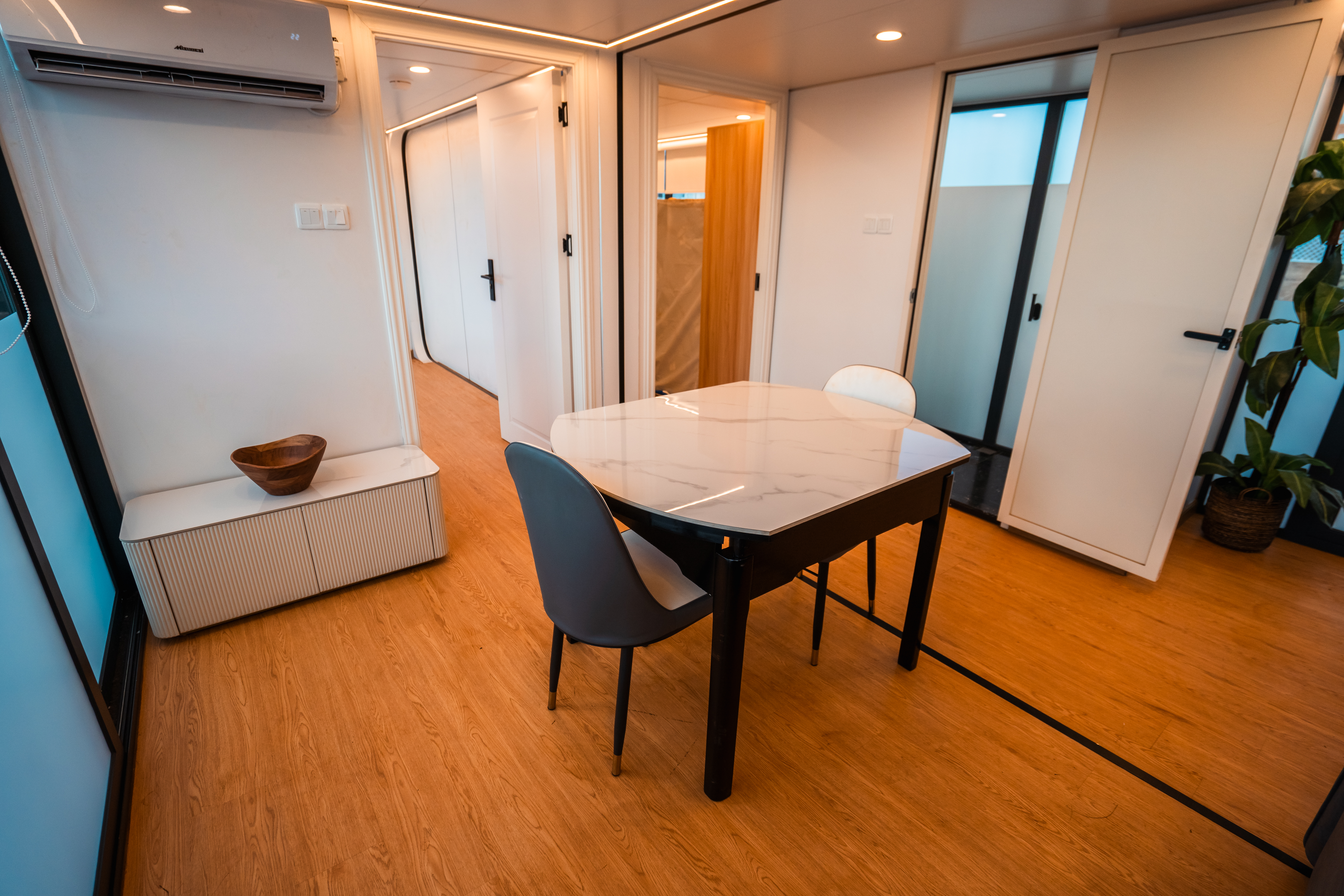 Double Unit dining area — marble table, AC unit