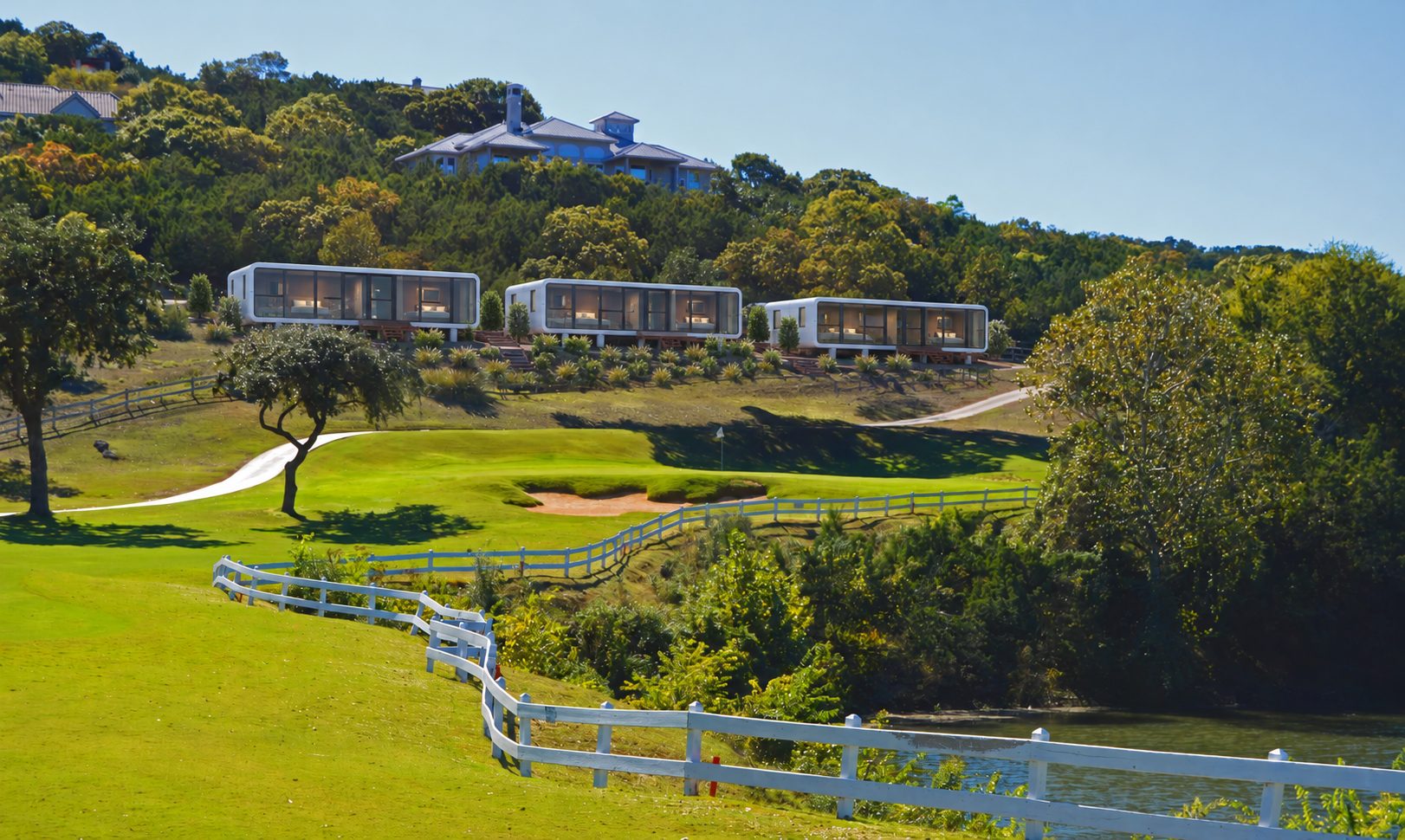 Modular stay-and-play villas above a hill country golf course